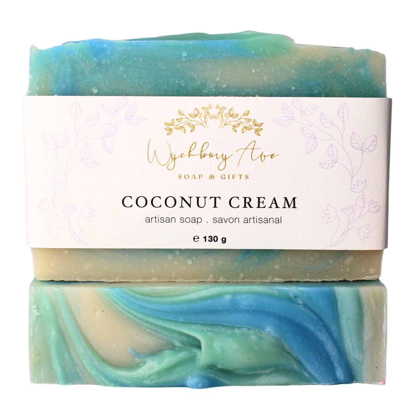 Bar of handmade soap with swirly details on top, colored in shades of blue and green with a gold detail, packaged in a clear and white branded wrapper.