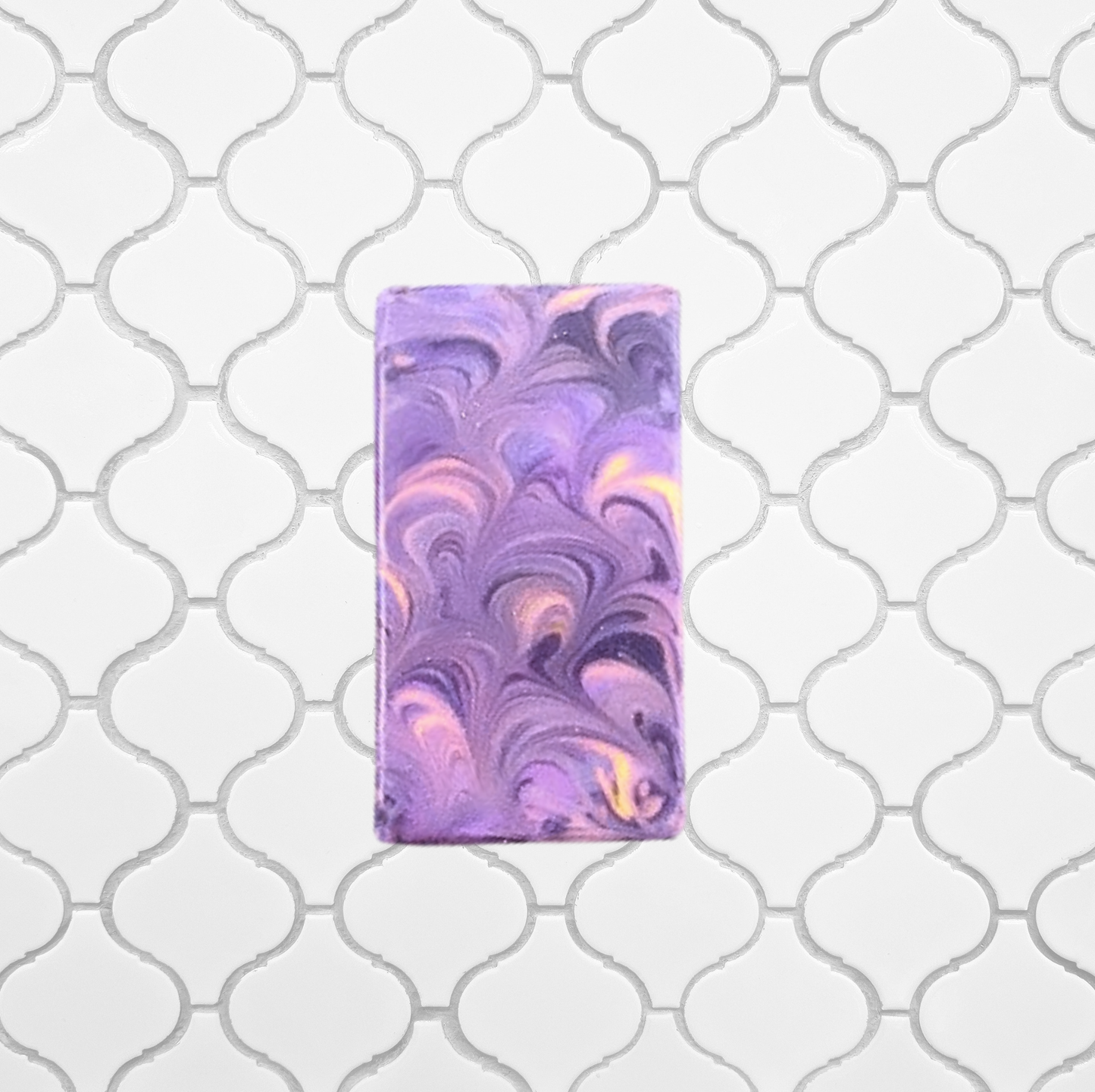 Marbled purple and pink soap bar on a white background