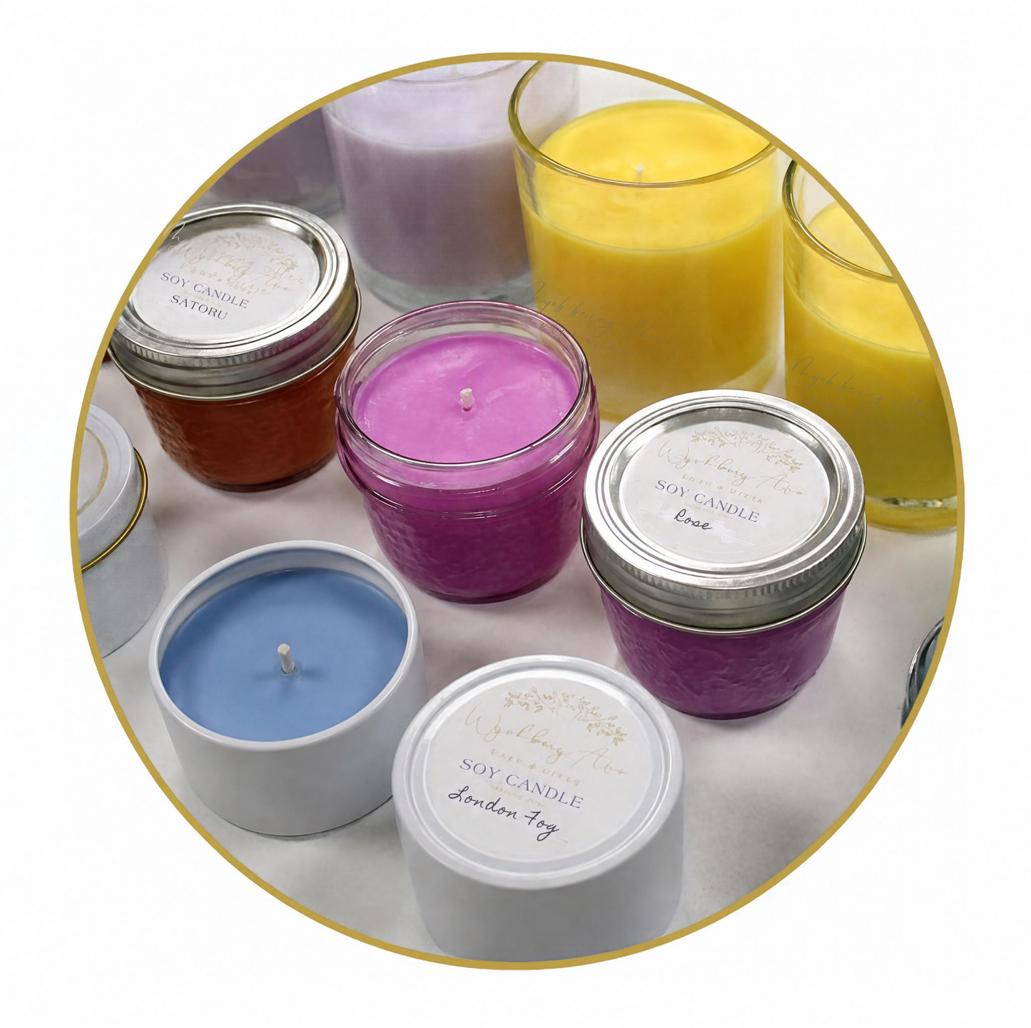 A collection of colorful soy candles in glass jars with silver lids, arranged inside a circular frame on a white surface. The visible candle colors include purple, yellow, blue, orange, and white, with one candle labeled 'lavender soy candle' and another 'scented wax'.