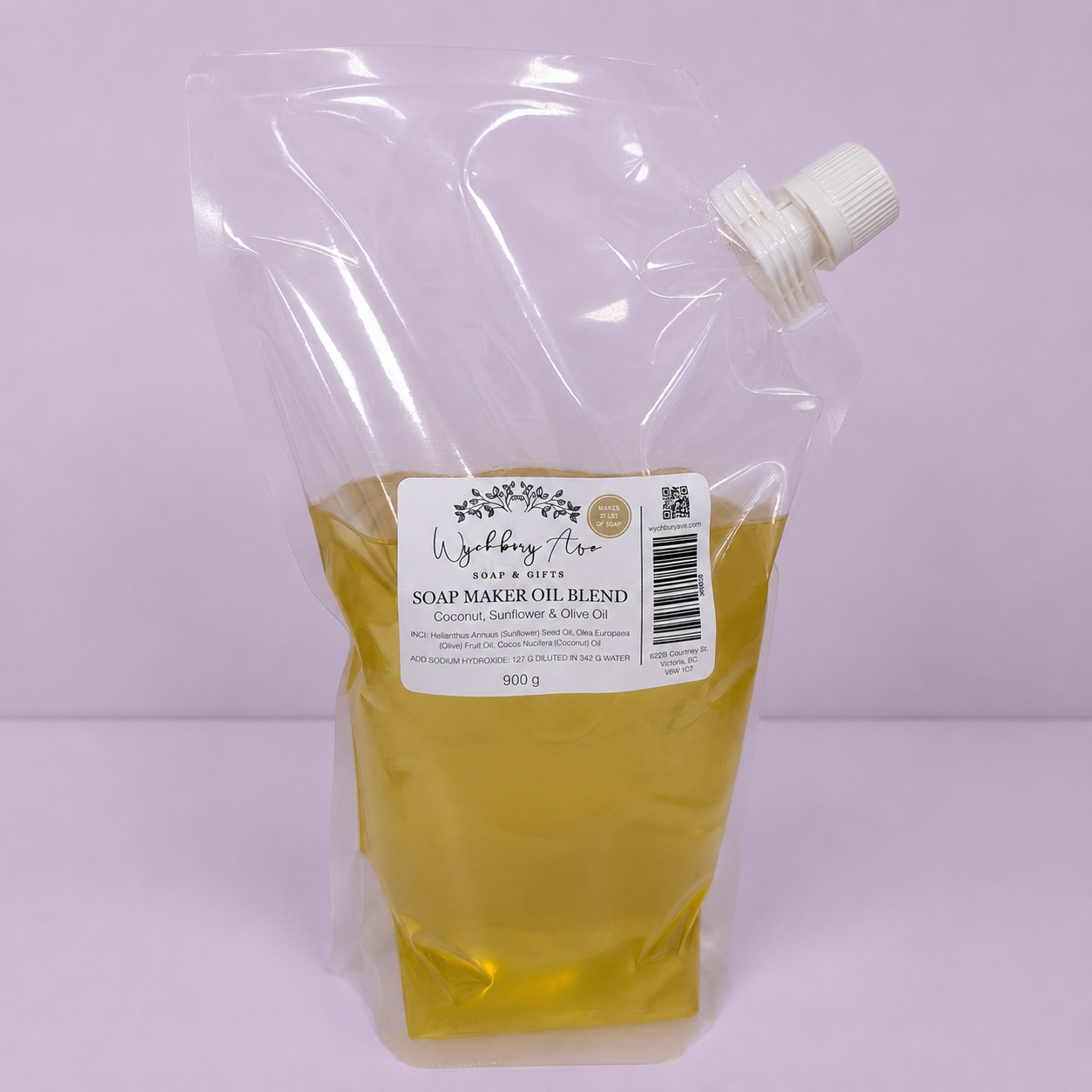 Bag of soap maker oil blend with a label on a light purple background