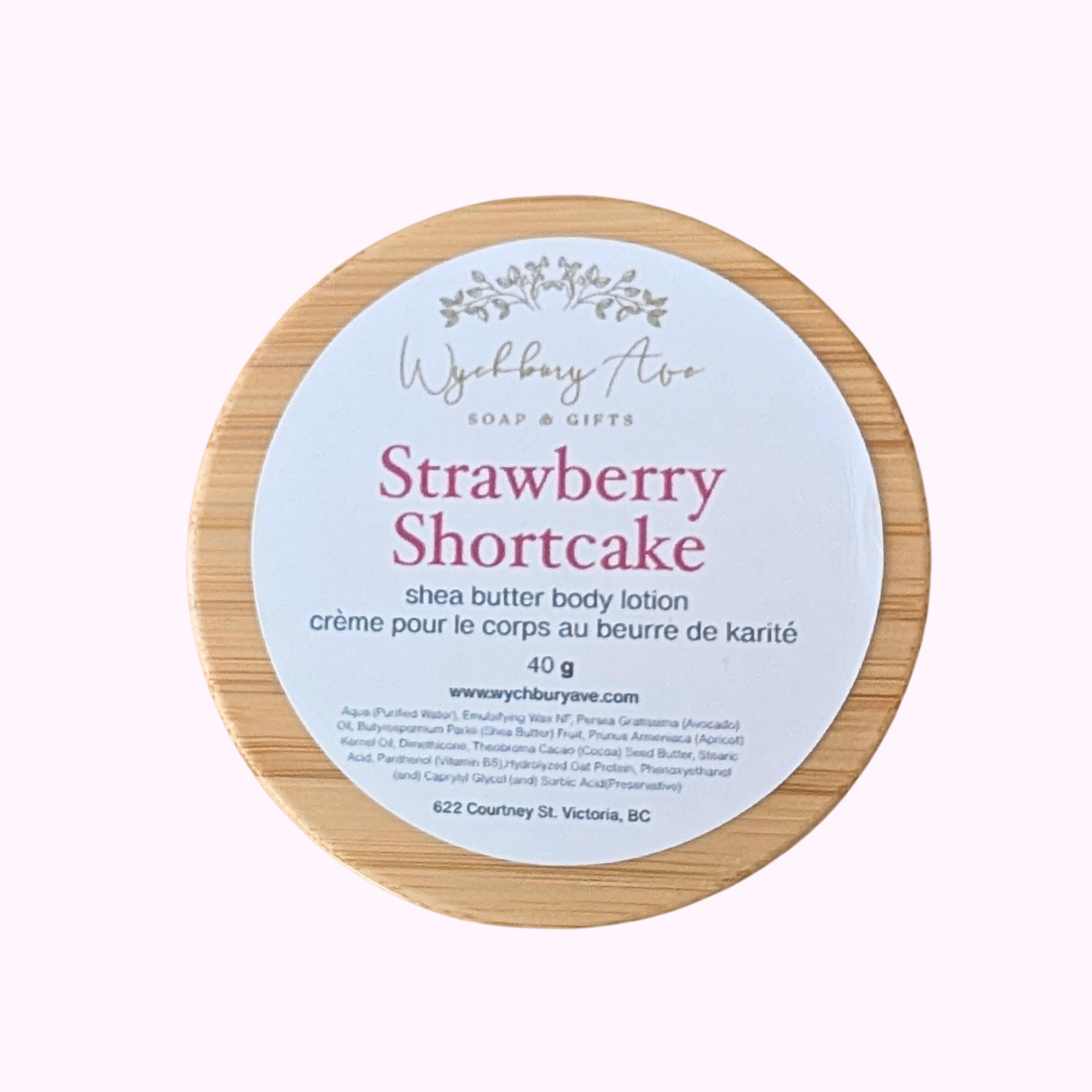 Shea butter body lotion container with 'Strawberry Shortcake' flavor on a white background