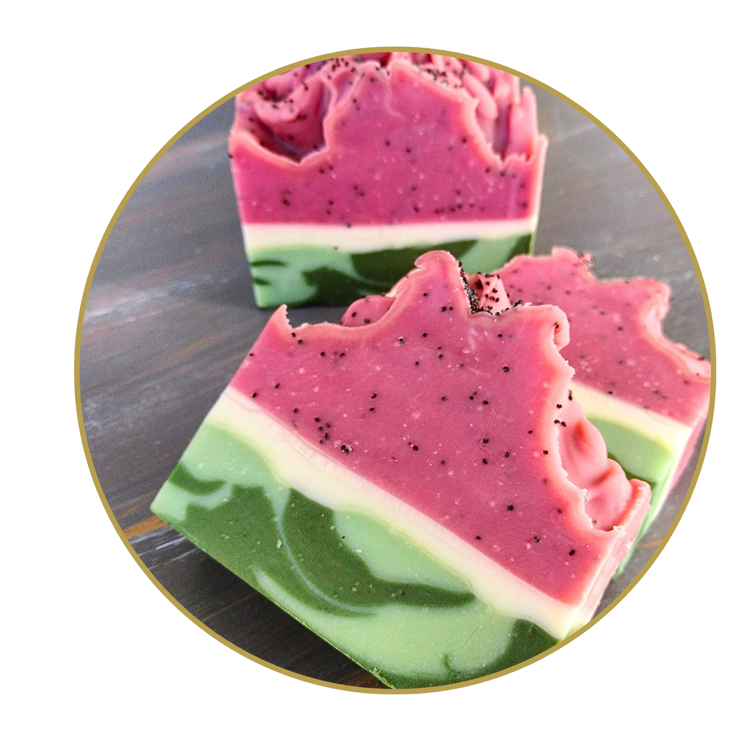 Three pieces of watermelon-themed soap on a reflective surface
