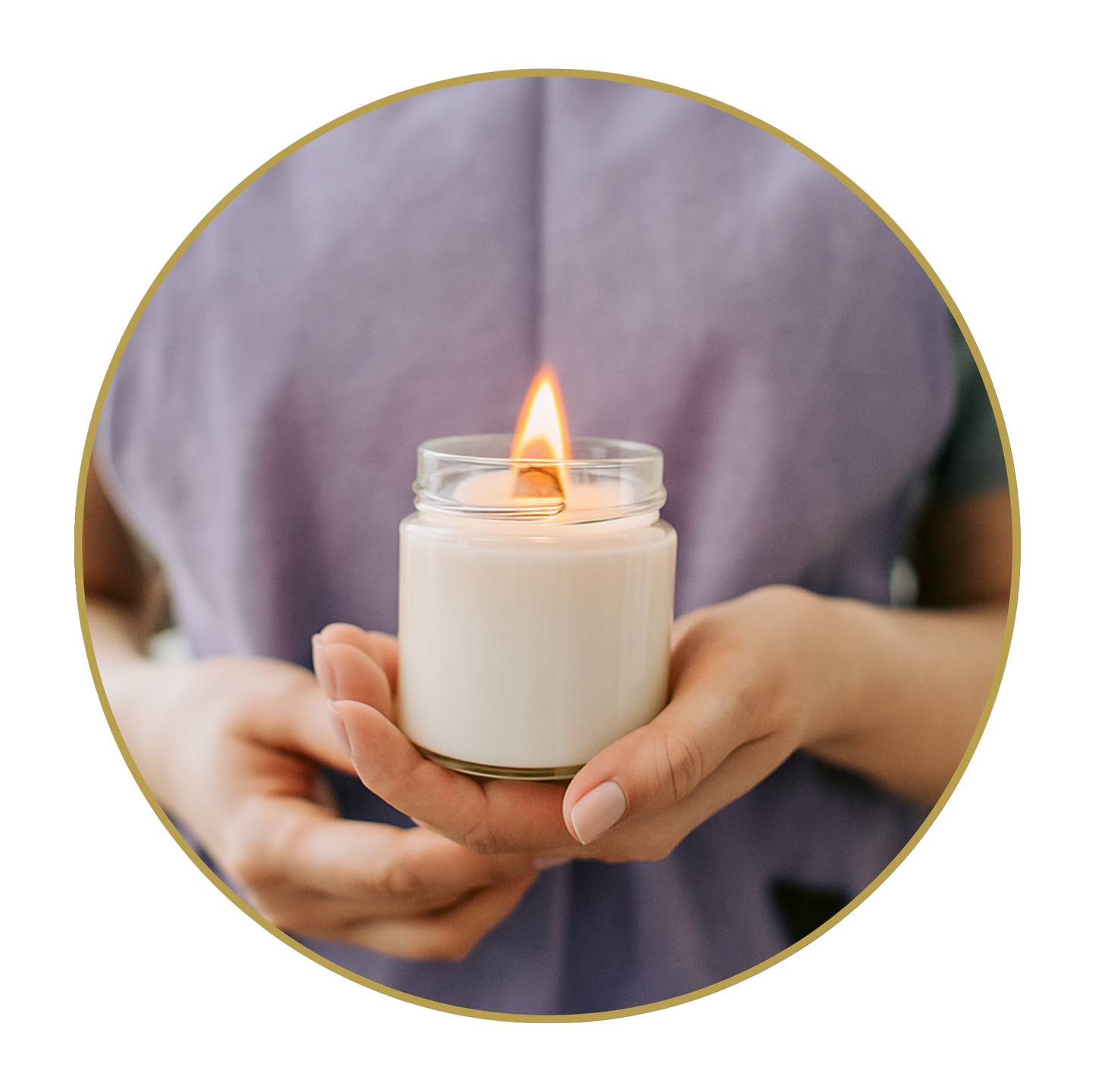 Person holding a small lit candle in a clear jar against a blurred background