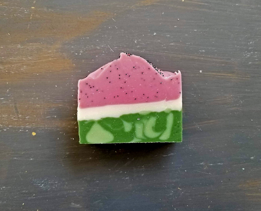 
                
                    Load image into Gallery viewer, Watermelon bar soap with pink top, white middle and mixed green rind that looks like real watermelon
                
            