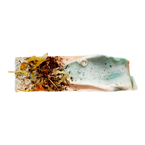 
                
                    Load image into Gallery viewer, calendula and vanilla powder on top of hibiscus ylang ylang soap
                
            