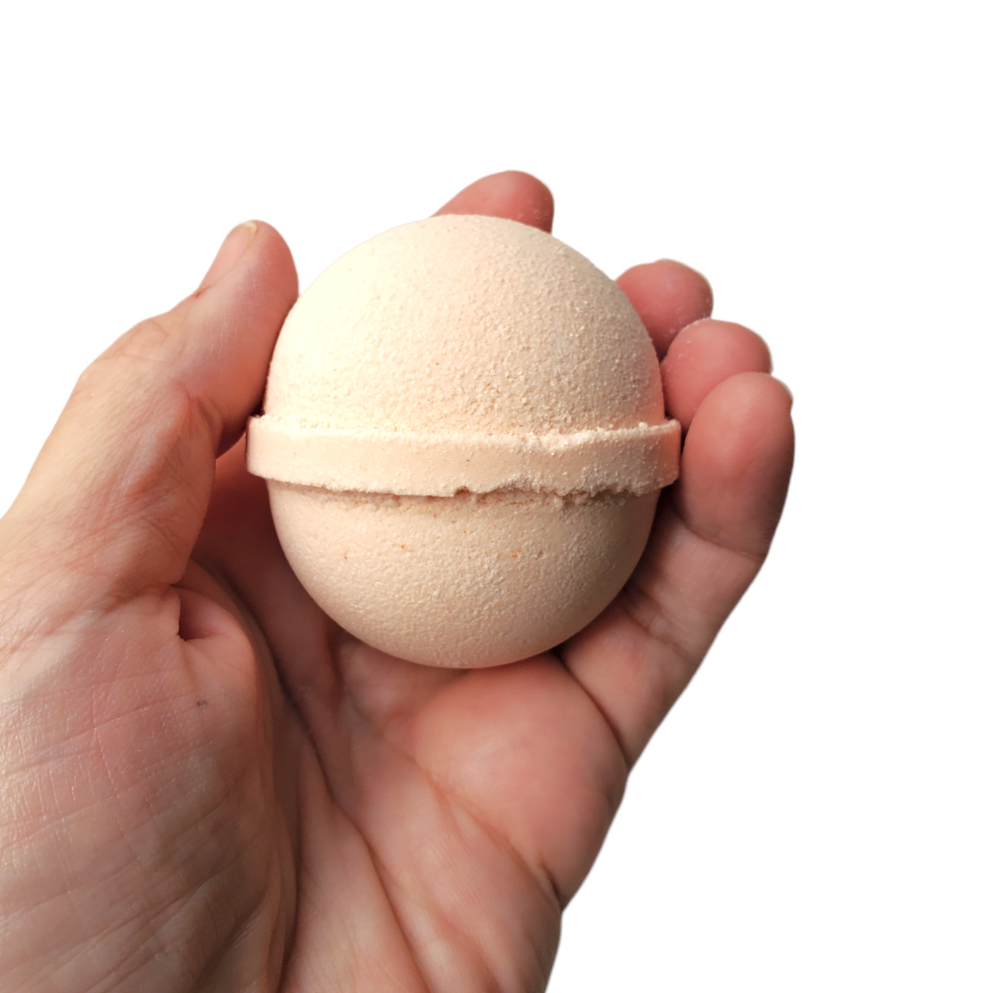 small satsuma bath bomb held in hand